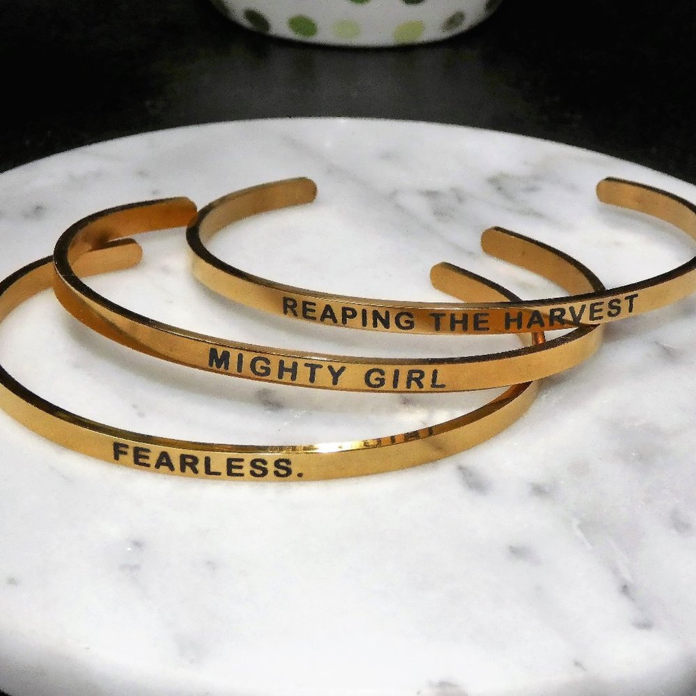 "Might Girl" "Reaping the Harvest" "Fearlesss" set of 3 gold tone cuffs